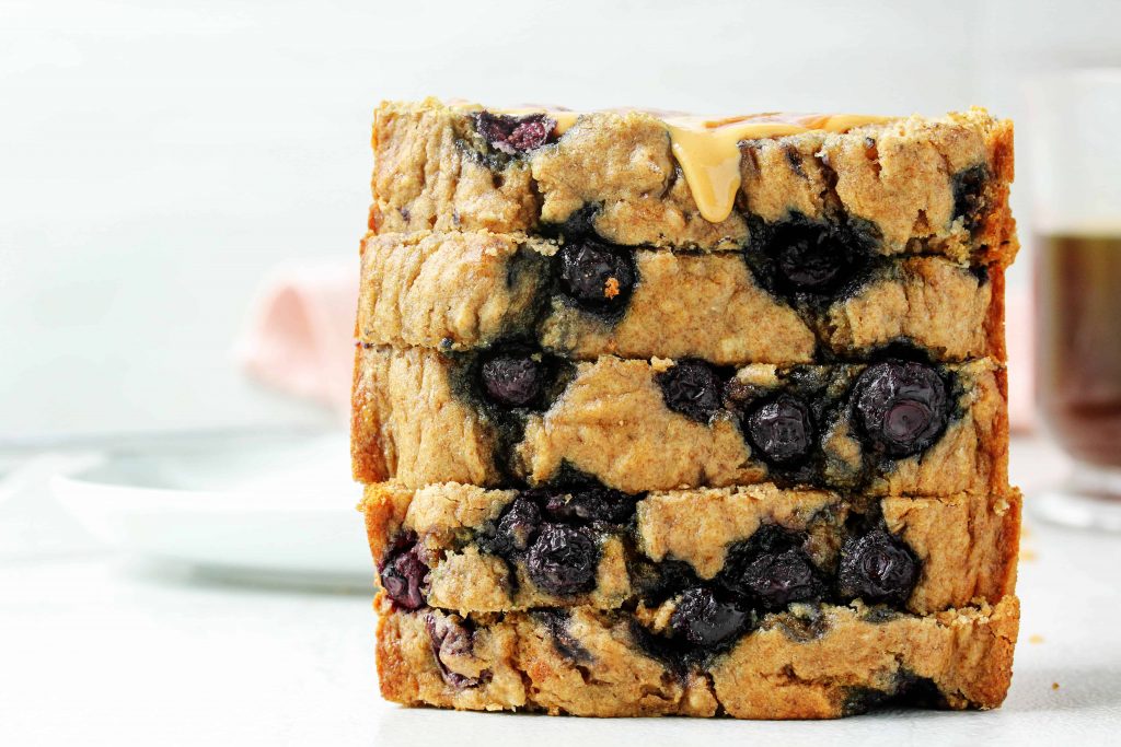 This healthy blueberry banana bread is a toast lover’s dream! You can make it gluten free or with whole wheat flour. Toast it up and spread it with your fave nut butter and jelly for the perfect quick and healthy snack! #glutenfree #lowfodmap #blueberry #bananabread