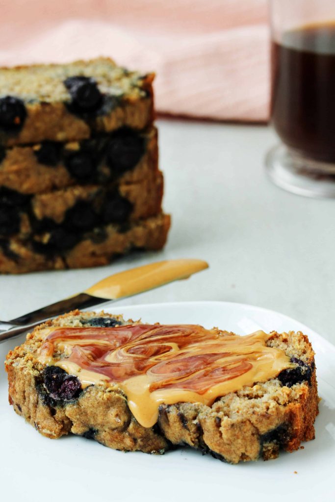 This healthy blueberry banana bread is a toast lover’s dream! You can make it gluten free or with whole wheat flour. Toast it up and spread it with your fave nut butter and jelly for the perfect quick and healthy snack! #glutenfree #lowfodmap #blueberry #bananabread